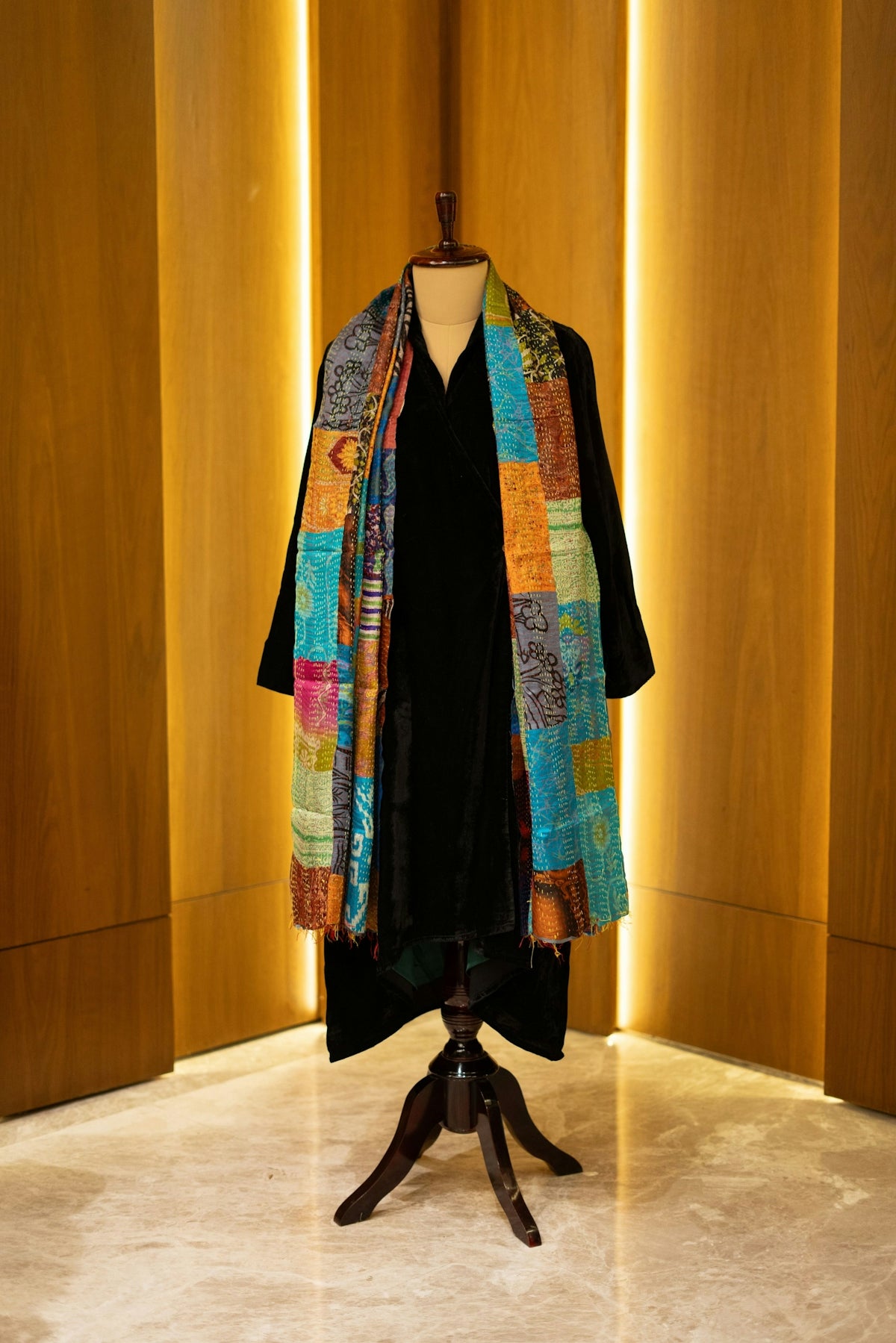 A dress on a mannequin in a room